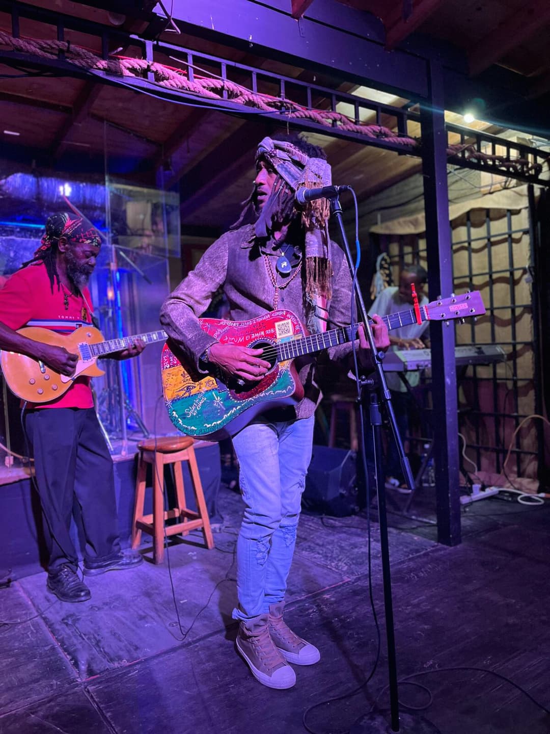 Ky-Enie King performing live with guitar